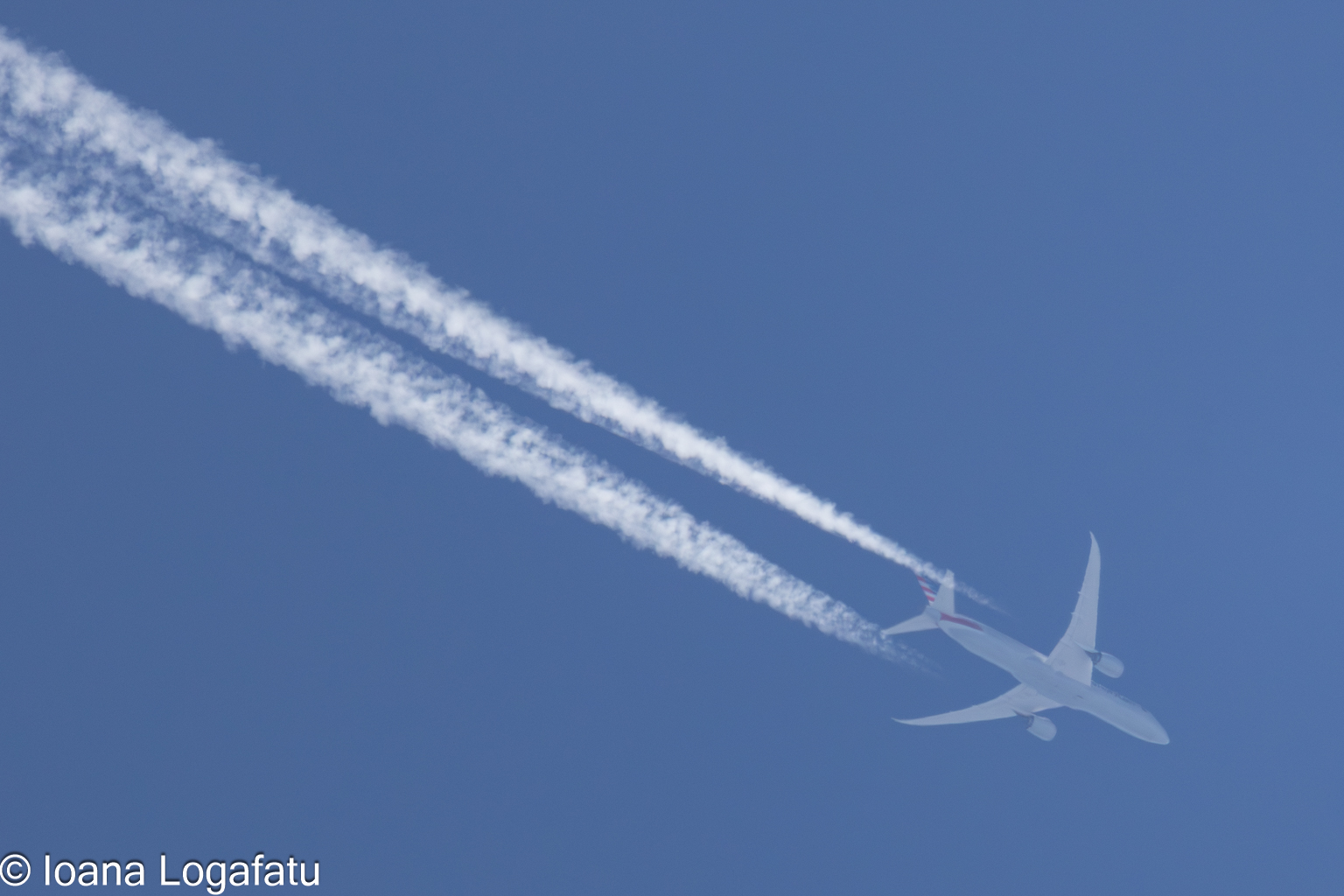 Jet flying through clear blue skies